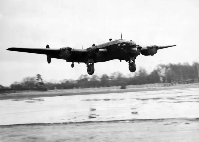 Framed Print : A Halifax bomber landing after a night raid over Italy during the second World War