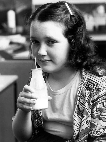 Hannah Chissick with a glass of milk. 2nd June 1987
