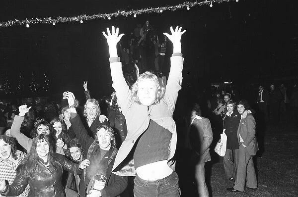 A happy crowd of young people greet the New Year in high-spirits in Broadgate, Coventry