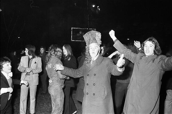 A happy crowd of young people greet the New Year in high-spirits in Broadgate, Coventry