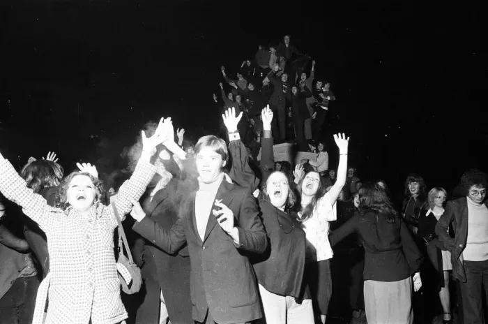 Framed Print : A happy crowd of young people greet the New Year in high-spirits in Broadgate, Coventry