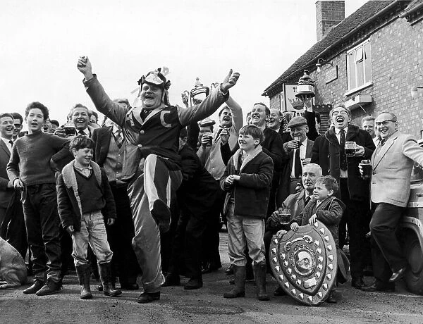 Happy days for Alvechurch fans. Mascot Tom Borrows leads the celebrations outside