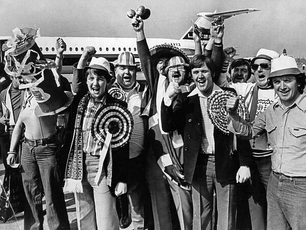 Happy Liverpool fans at Speke Airport before flying to Italy to watch their team take