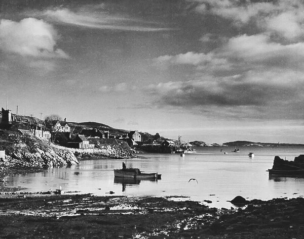 Harbour scene in the Hebrides, Scotland. Circa 1960