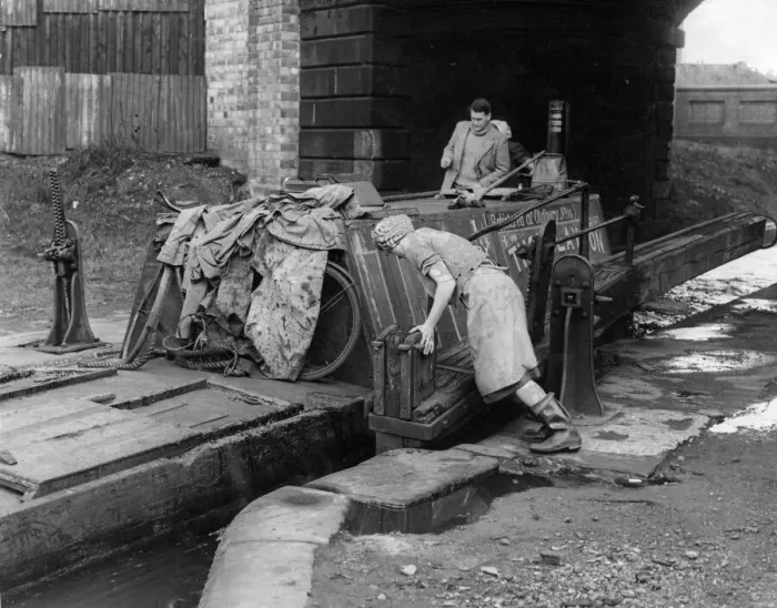 Framed Print : Hard Realities: Its a man-sized job shifting a huge timbered canal narrow boat Framed Print : Hard Realities: Its a man-sized job shifting a huge timbered canal narrow boat
