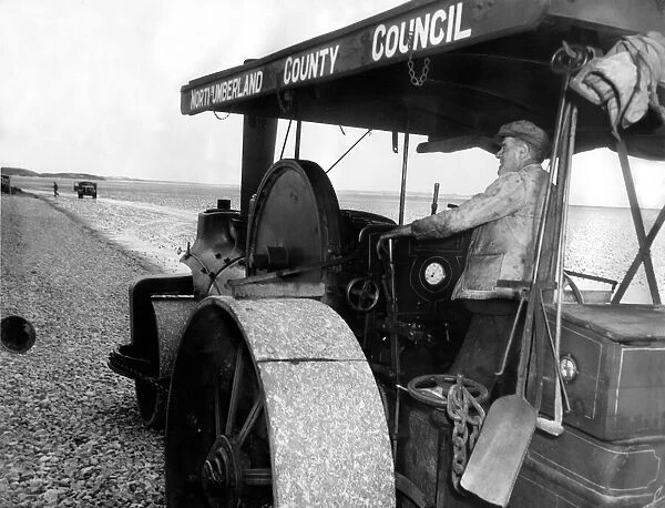 Bill Harmeston uses a Northumberland County Council steam roller to level out the track