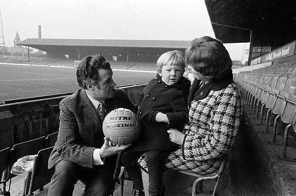 Harold Shepherdson presenting a football to a young boy. 1971