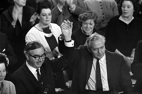Harold Wilson and George Brown hold hands aloft at the end of the conference 1963