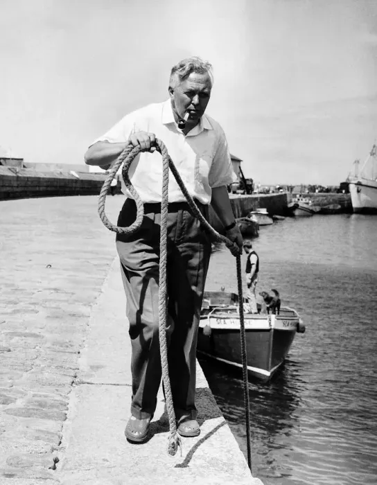 Framed Print : Harold Wilson MP on holiday in the Scilly Islands 1963 ties up his boat Framed Print : Harold Wilson MP on holiday in the Scilly Islands 1963 ties up his boat