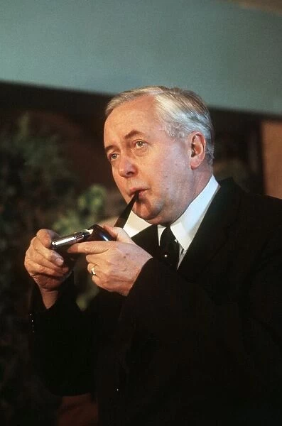 Harold Wilson former MP lighting a pipe circa 1975