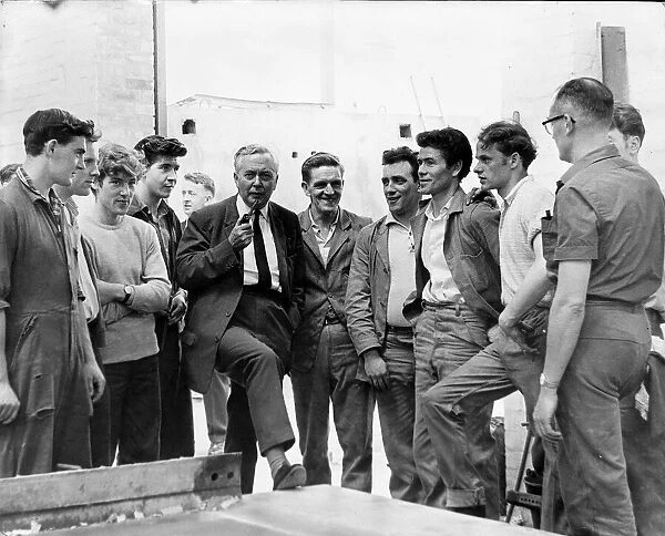 Harold Wilson MP talking with workers at the stock yard of unit construction as he opens