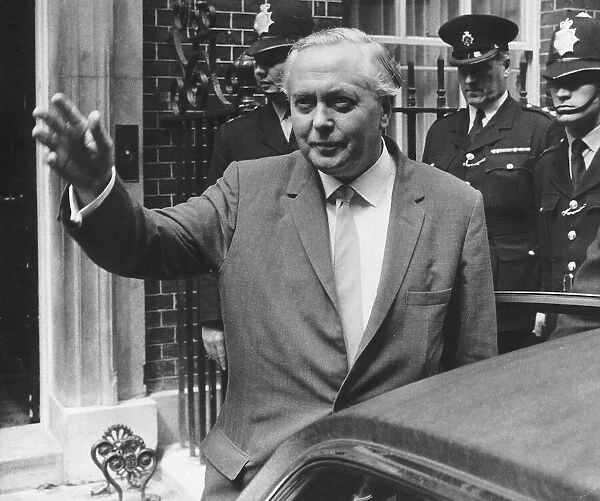 Harold Wilson Prime Minister leaving No 10 Downing street with policemen behind him 1966