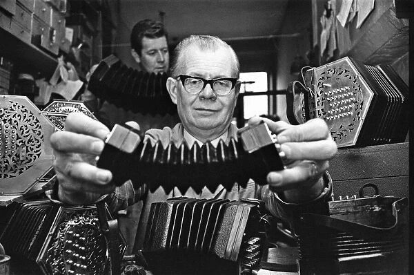 Harry Crabb seen here with his son Neville making concertina