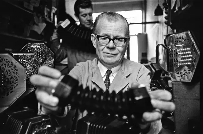 Framed Print : Harry Crabb seen here with his son Neville making concertina Framed Print : Harry Crabb seen here with his son Neville making concertina