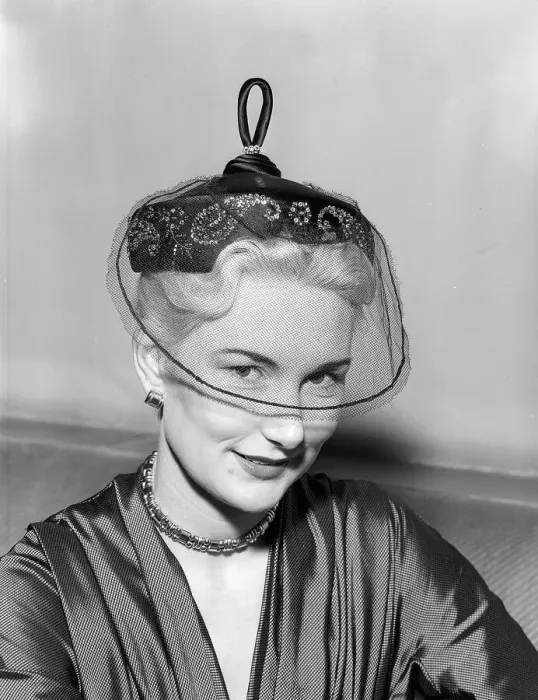 Framed Print : Hat Fashion by Norman Hartnell Unusual hat with netting covering the eyes Framed Print : Hat Fashion by Norman Hartnell Unusual hat with netting covering the eyes