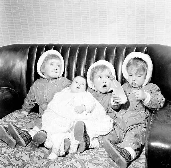 The Hatton triplets from Manchester, Deborah, Sharon and Allison with their baby sister