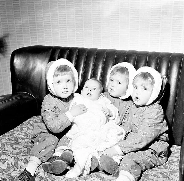 The Hatton triplets from Manchester, Deborah, Sharon and Allison with their baby sister