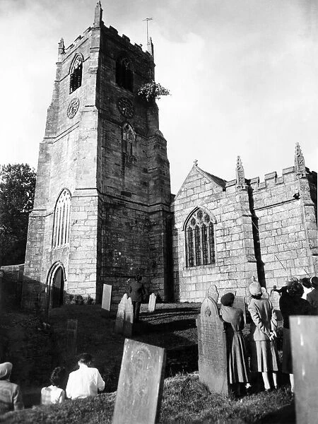 Hauling the sapling up the church tower. May 1960 P005050