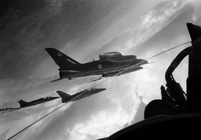 Framed Print : Hawker Siddeley Gnat T1s of the Red Arrows fly inverted as they perform a loop in Framed Print : Hawker Siddeley Gnat T1s of the Red Arrows fly inverted as they perform a loop in
