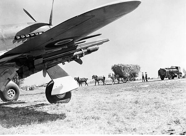 Hawker Typhoon armed with rockets and ready for takeoff from an English field during