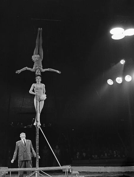 Head balancing act in the ring at the Bertram Mills Circus in Cambridge April 1959