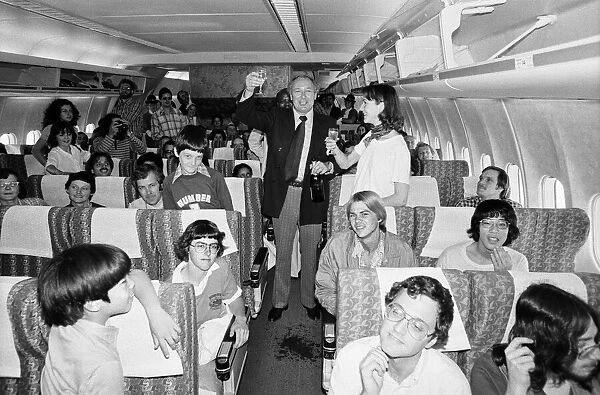 Head of Laker Airways Freddie Laker mingles with passengers on board his translatlantic