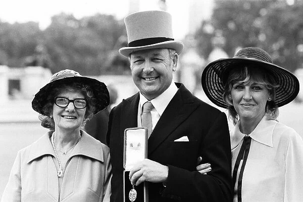 Head of Laker Airways Freddie Laker with his wife and mother at Buckingham Palace after