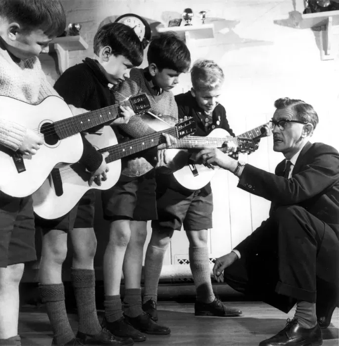Framed Print : Heamaster Harry Speak of Prestwich Parish C of E Junior School gives guitar lessons to Framed Print : Heamaster Harry Speak of Prestwich Parish C of E Junior School gives guitar lessons to
