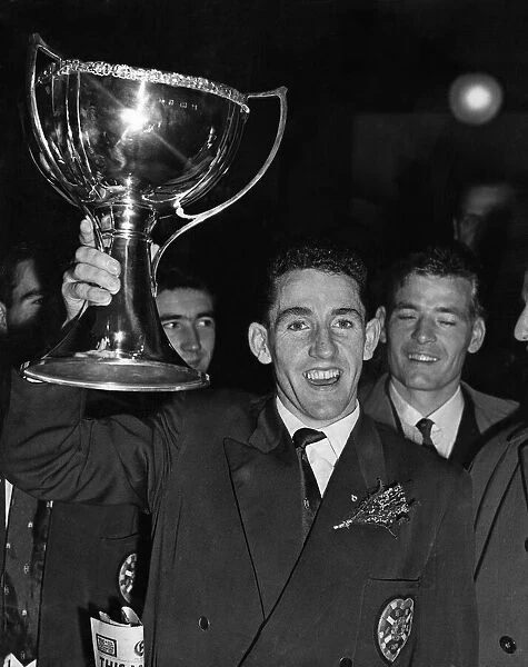 Hearts captain Dave Mackay proudly holds aloft the league cup. 25th October 1958