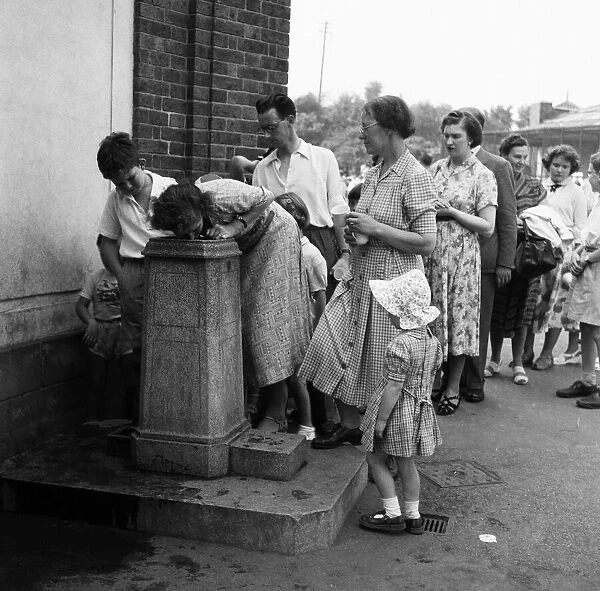 Heatwave at London Zoo. People queue for water. 22nd August 1955