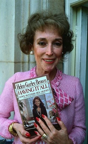 Helen Gurley Brown November 1984. Author holding a copy of her book Having It All