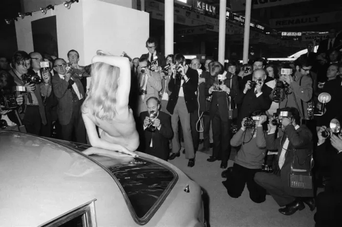 Framed Print : Helen Jones posing topless and drawing the attention of photographers to the TVR stand