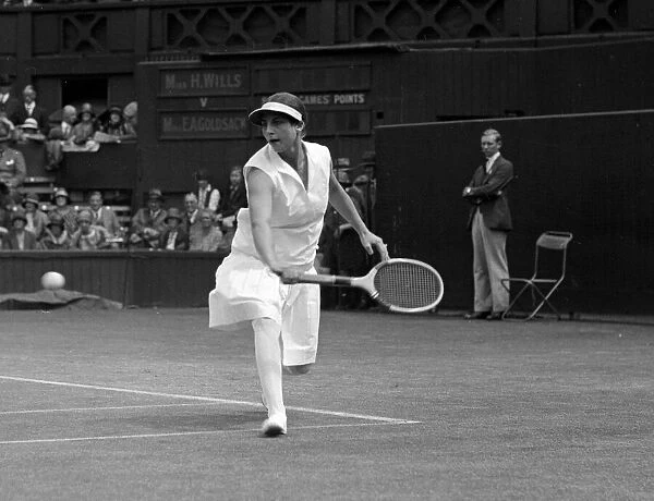 Helen Wills at the Wimbledon tennis championships returning a backhand shot July