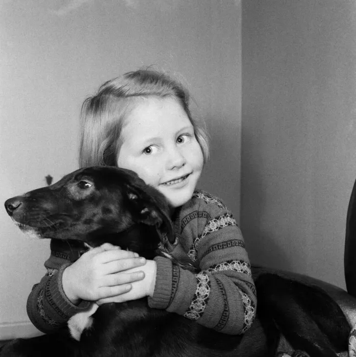 Framed Print : Helen Windle, aged 5, of Doncaster, with Janey, the puppy she helped save from a dogs Framed Print : Helen Windle, aged 5, of Doncaster, with Janey, the puppy she helped save from a dogs