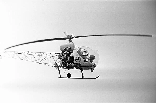 Helicopter above a Pop Concert in Berkshire. Circa 26th  /  27th August 1974