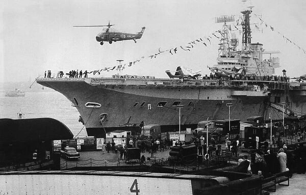 A helicopter taking off from the aircraft carrier HMS Centaur
