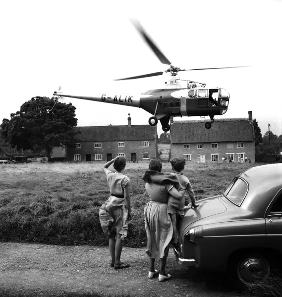 Helicopter a Westland helicopter kinds on the village green at nether Compton