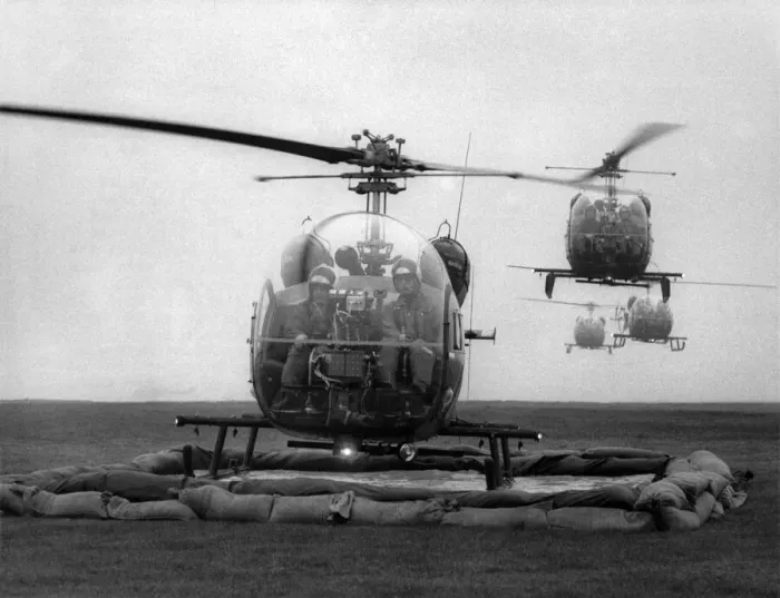 Framed Print : Why Helicopters are Taking a Dep: Army helicopters queued up to take a dip in