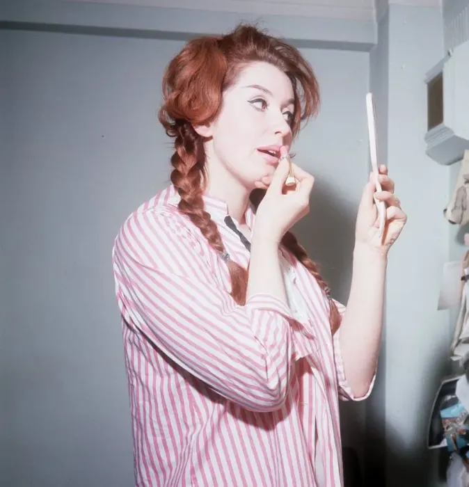 Framed Print : Heller Toren model actress 1964 puting on lipstick holding hand mirror pink striped shirt Framed Print : Heller Toren model actress 1964 puting on lipstick holding hand mirror pink striped shirt