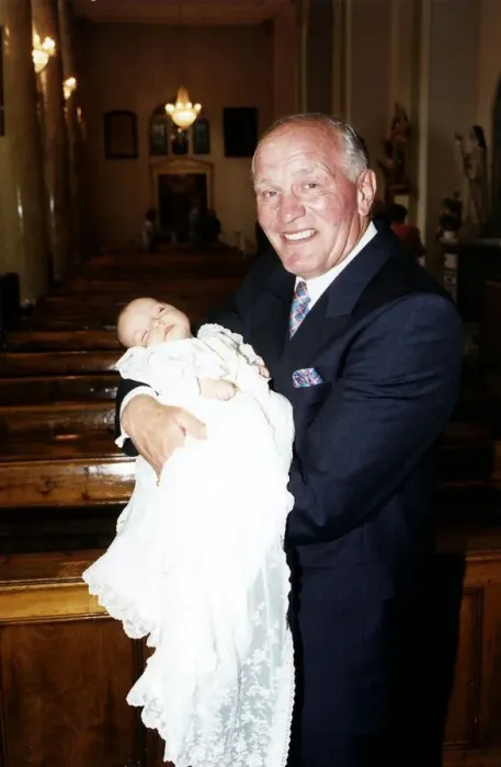 Framed Print : Henry Cooper, Boxing and Sports Personality holding his new grand child at Christening Framed Print : Henry Cooper, Boxing and Sports Personality holding his new grand child at Christening