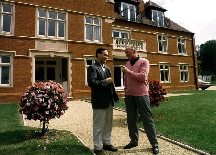 Framed Print : Henry Cooper Boxing and sports personality with his son Henry Jr outside his house Framed Print : Henry Cooper Boxing and sports personality with his son Henry Jr outside his house