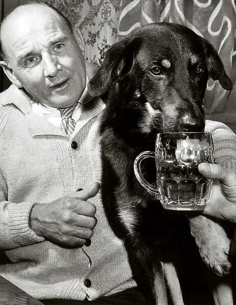 Henry Cooper and dog Ace enjoy a pint August 1964