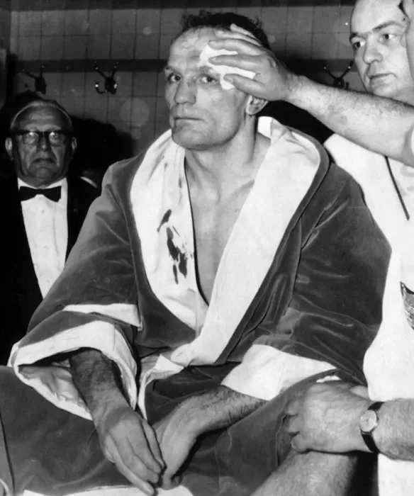 Framed Print : Henry Cooper having his wounds attended to in dressing room May 1966 after the World Framed Print : Henry Cooper having his wounds attended to in dressing room May 1966 after the World