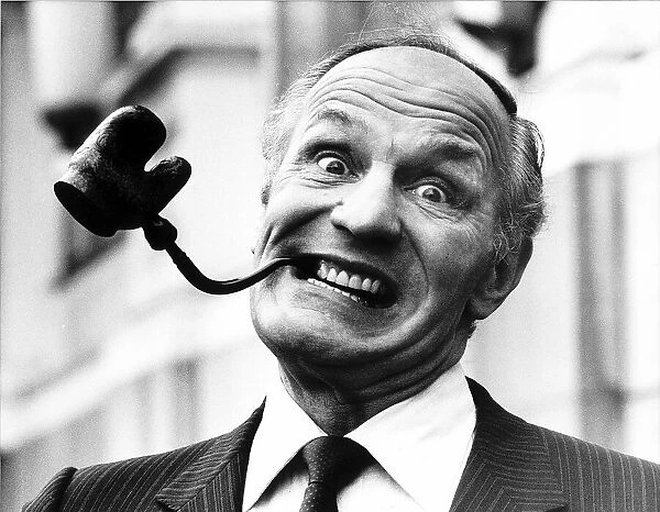 Henry Cooper Former Heavyweight Boxer January 1984 smoking an unusual shaped pipe