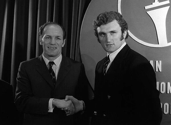 Henry Cooper and Joe Bugner shake hands at the Sportsman Club after signing to fight