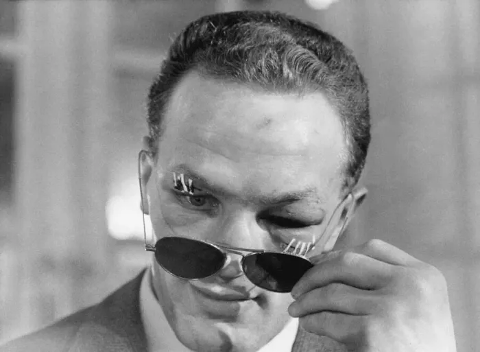 Framed Print : Henry Cooper, the new British and Empire Heavyweight boxing champion looks from behind Framed Print : Henry Cooper, the new British and Empire Heavyweight boxing champion looks from behind