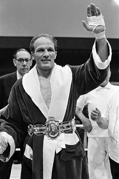 Henry Cooper receiving the Lonsdale belt after his win in the fight against Jack Bodell