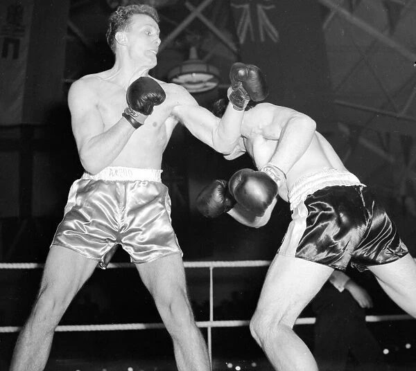 Henry Cooper seen here in a bout against Ted King November 1954