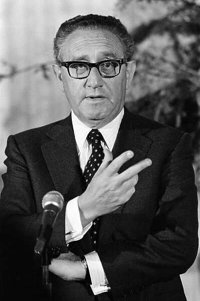 Henry Kissinger speaking at a press conference, answering questions about his latest book