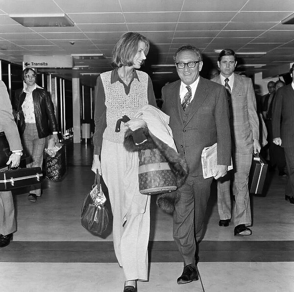 Henry Kissinger and his wife Nancy at London airport. 23rd April 1977